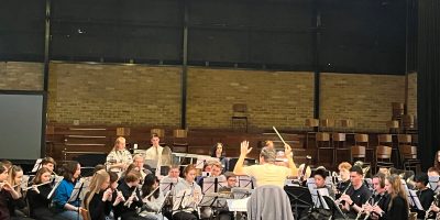 Wind orchestra musicians performing